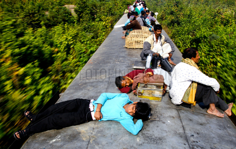 People travel roof of the train