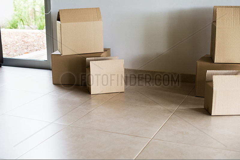 Cardboard boxes in empty living room