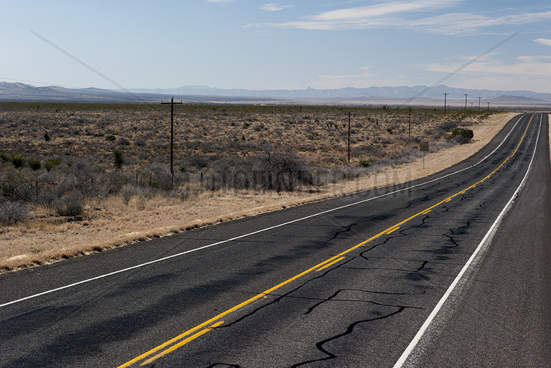 Highway through desert landscape