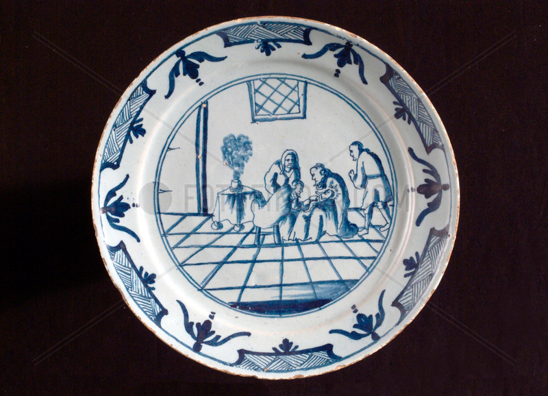 Tin glazed earthenware plate,  English,  18th century.