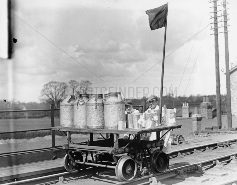 Dairymen transporting dairy products to the