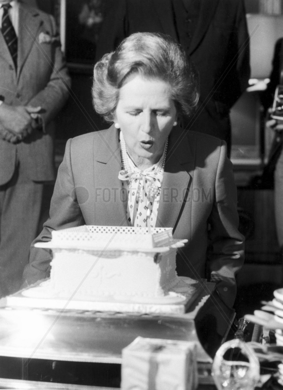 Margaret Thatcher blowing out candles,  c 1983.