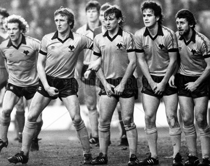 Wolverhampton Wanderers guard against a Liverpool free kick,  1980s.