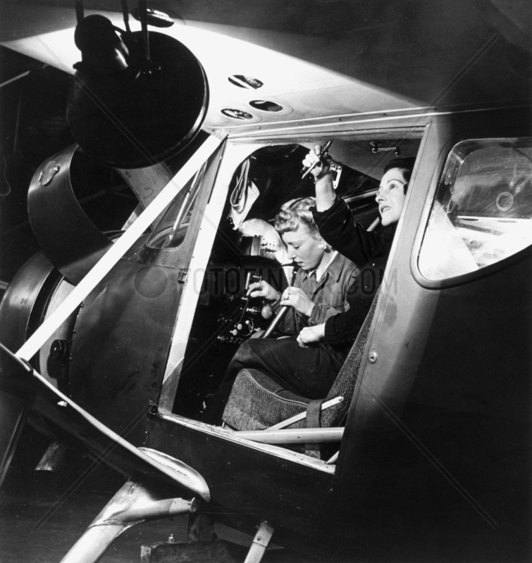 Women working in the cockpit of an aeroplan