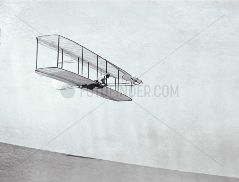 The Wright Brothers' modified third glider in flight,  1902.