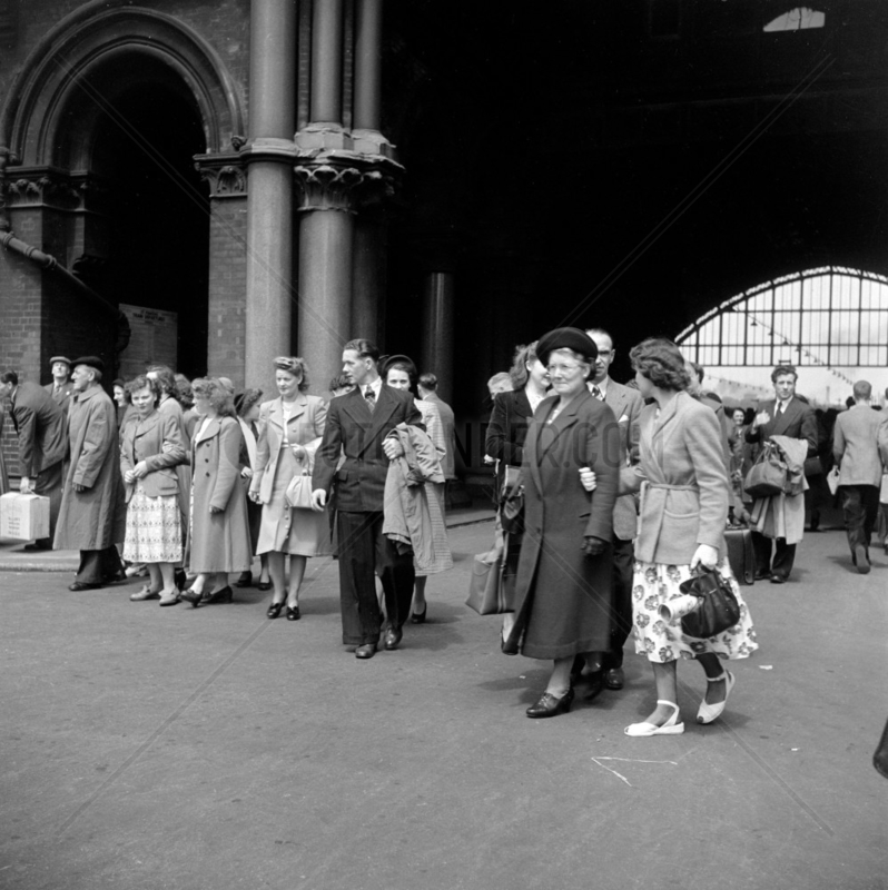 Group of tourists at St Pancras Station,  London,  1950.