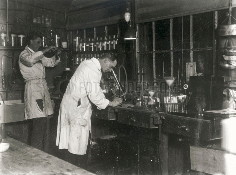 Two scientists at work in a laboratory,  c 1930s.
