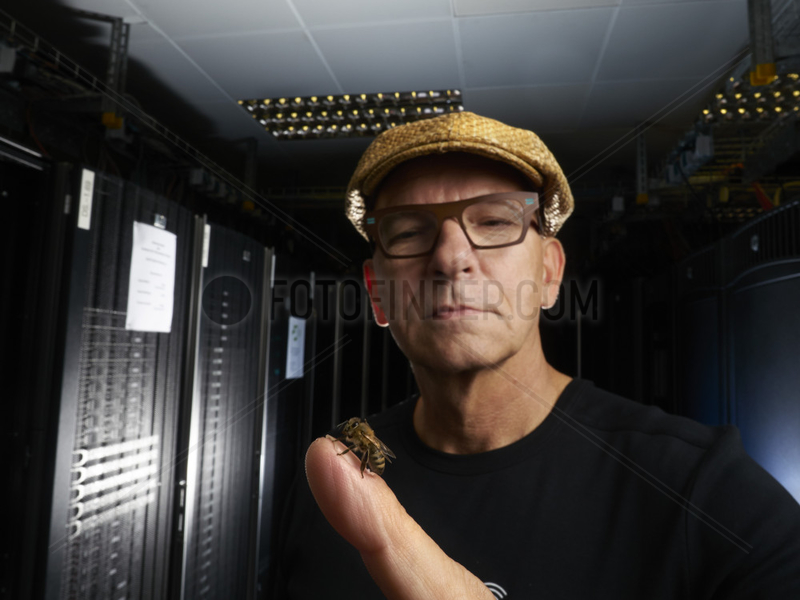 Apidologie - Portrait of Gerhard Vonend,  IT engineer,  in front of the digital storage center of the Hobos research center. Hobos - Wuerzburg university,  Germany.