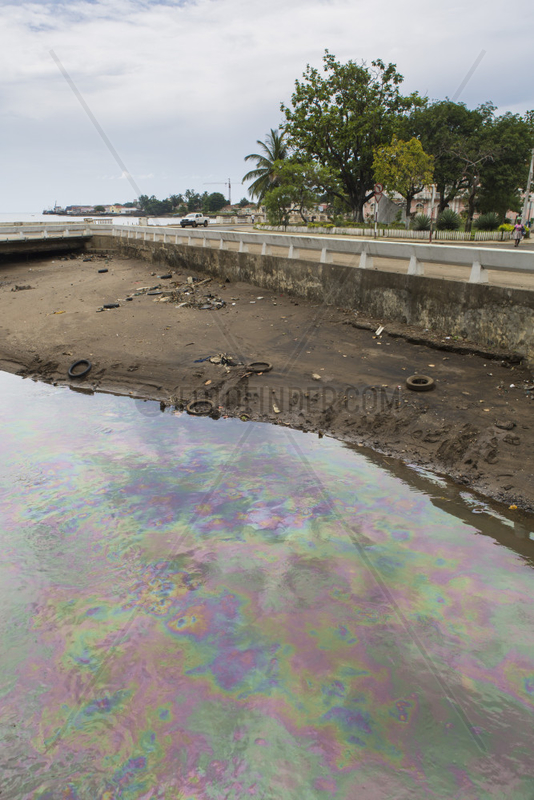 Gasoline on the surface of the Agua Grande Canal in the capital of Sao Tome,  Sao Tome and Principe Island