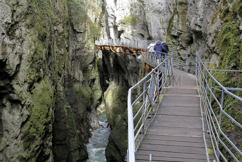 Group of people strolling in Fier Gorges,  a rearranged natural site in Lovagny,  Alpes,  France