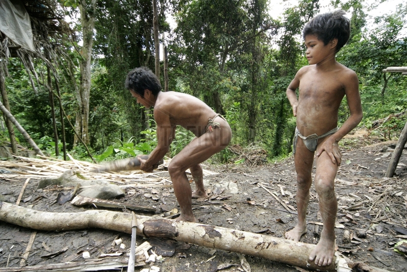 Man and boy cutting wood Tau't Batu Palawan Philippines