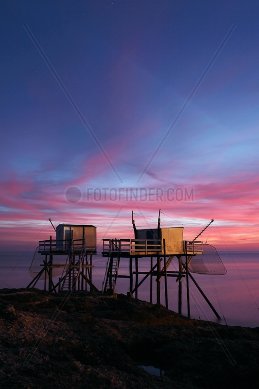 Pontoon and fishing shack liftnet at dusk - France