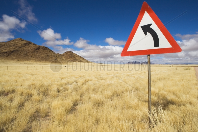 Curve sign Grass in Namib Desert after unusual rains Namibia