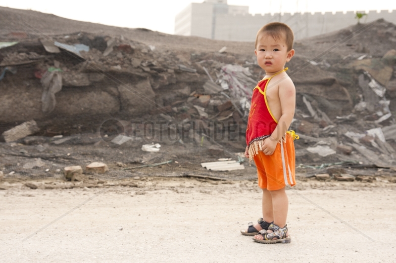 Young boy is in the suburb of Beijing China