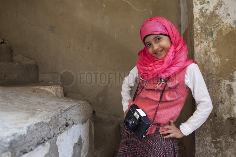 Girl in a class of Shatila with a camera - Lebanon
