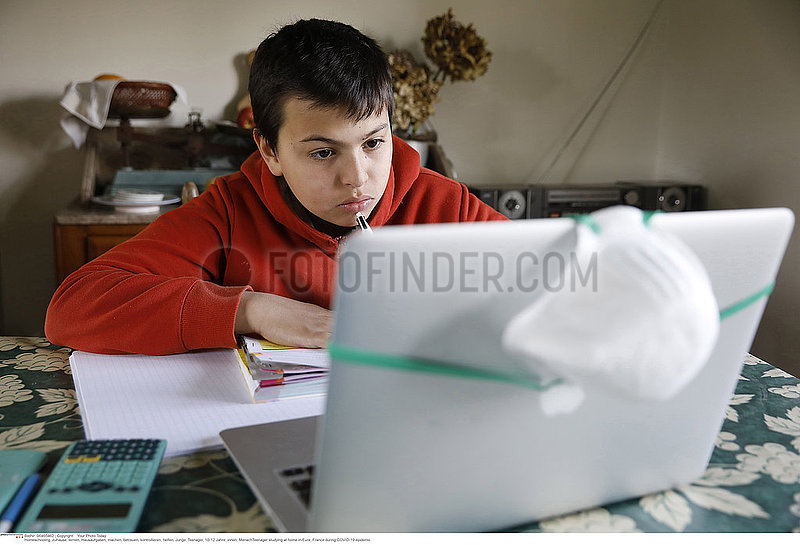 Teenager studying at home in Eure,  France during COVID-19 epidemic