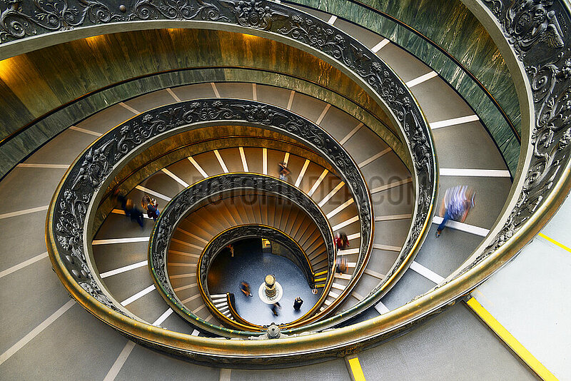 Italy. Lazio. Rome. Vatican Museums. The Bramante staircase is a famous monumental spiral staircase (allegorical double helicoidal),  which acts as an exit for the public. Reserved initially for riders,  it was built in 1932 by the Italian architect Giuseppe Momo (pontificate of Pope Pius XI) and inspired by a nearby Renaissance staircase from the 16th century by the architect Bramante