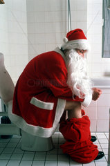 Weihnachtsmann auf Toilette