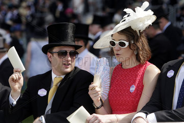 Royal Ascot  Couple in elegant clothes waiting for the next race
