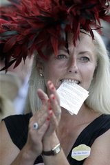 Royal Ascot  Woman with hat keeps betting tickets between her teeth