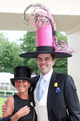 Royal Ascot  Fashion on Ladies Day  couple with witty hats at the racecourse