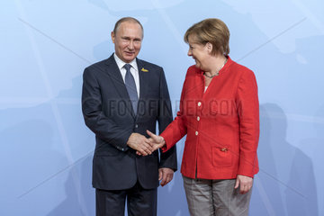 Putin + Merkel