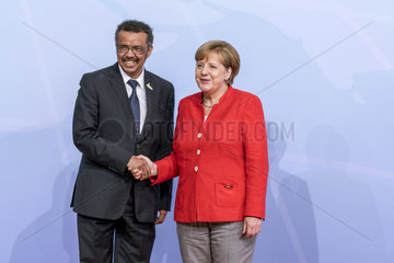 Ghebreyesus + Merkel