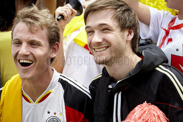 German football supporters smiling at match