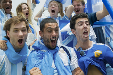 Argentinian football fans shouting in victory at match