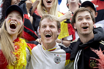 German football fans cheering at match