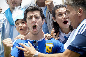 Argentinian football fans cheering at match