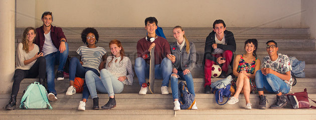 College students relaxing together on bleachers