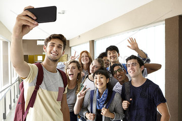 Students posing for group selfie