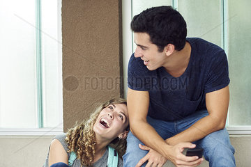 Young couple hanging out and laughing together