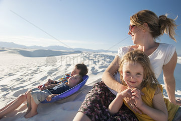 Family relaxing together at White Sands National Monument  New Mexico  USA