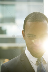 Businessman looking down in thought  portrait
