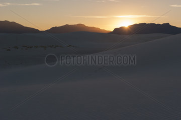 Sunset over dunes at White Sands National Monument  New Mexico  USA