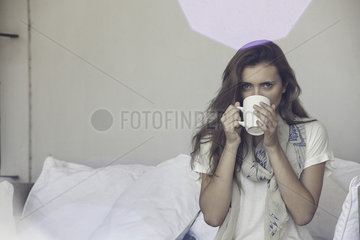 Woman drinking cup of tea