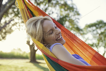 Woman relaxing in hammock
