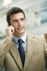 Businessman talking on cell phone  portrait