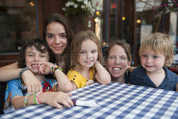 Family together at outdoor cafe  portrait