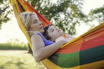 Mother and son napping together in hammock