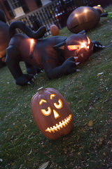 Illuminated jack-o-lantern and Halloween decorations