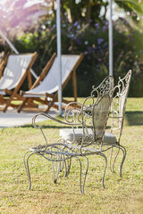 Wrought iron chairs in yard