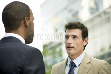 Businessmen talking outdoors