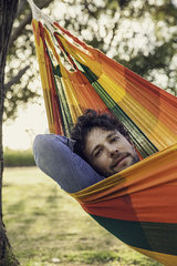Man relaxing in hammock  portrait