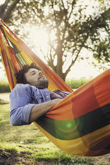Man napping in hammock