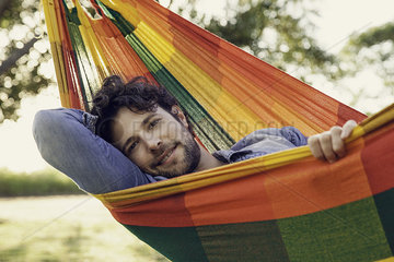 Man relaxing in hammock  portrait