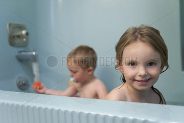 Young siblings taking a bath