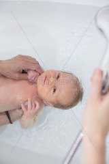 Newborn baby having bath